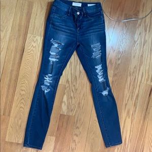 pace in ripped blue jeans